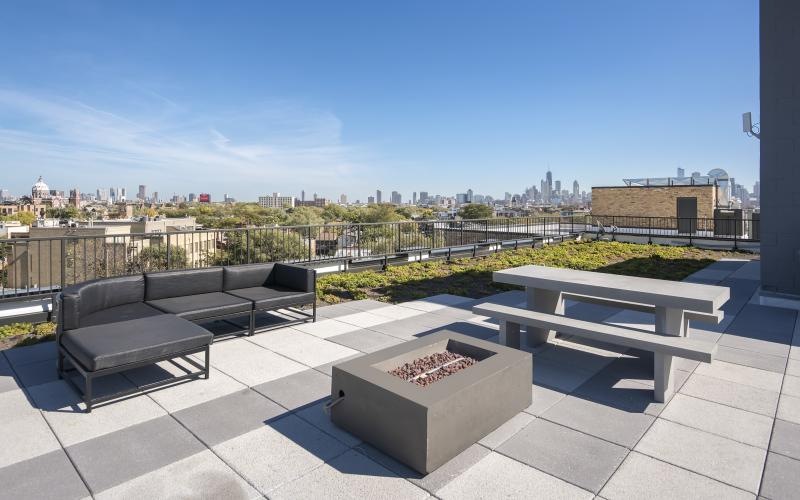 a deck with benches and a city in the background