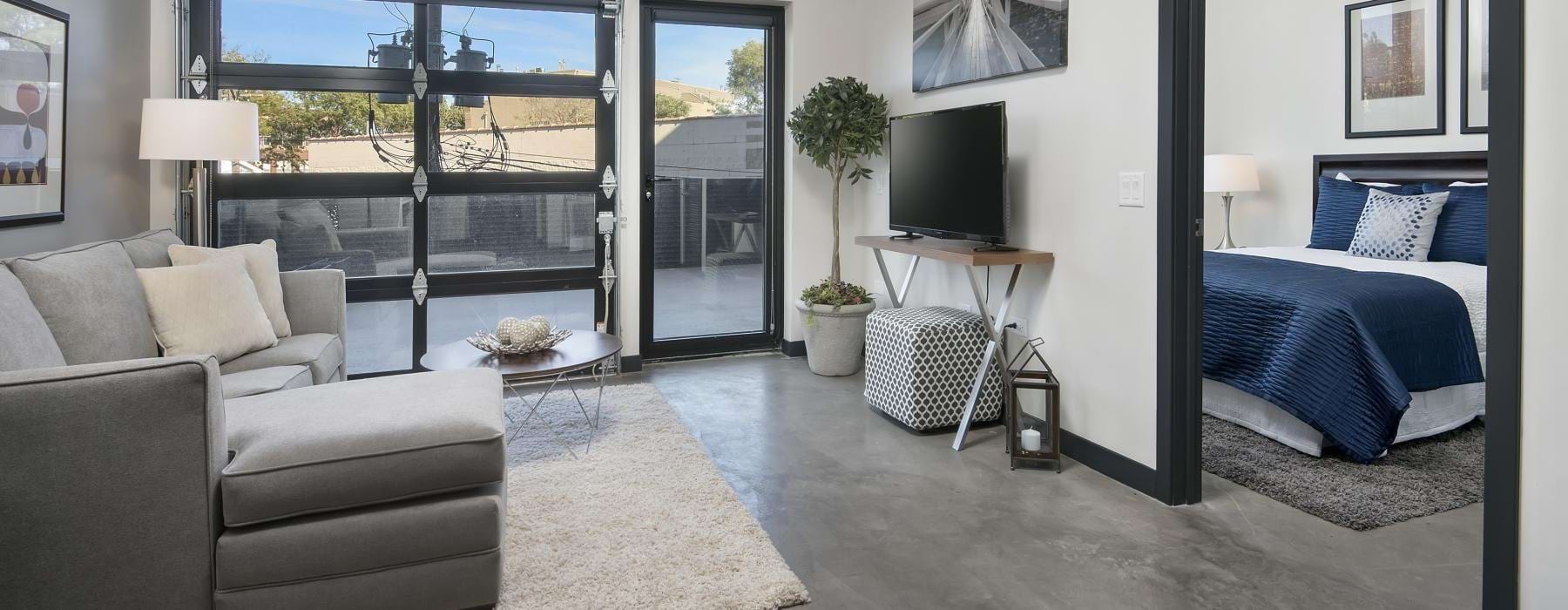 a living room with a garage style door