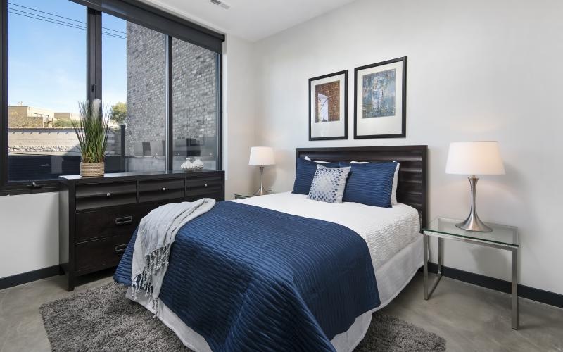a bedroom with a large window