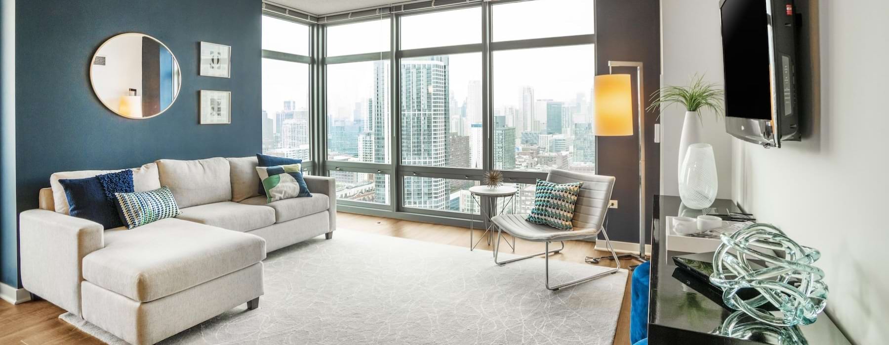 living room with windows and view of city