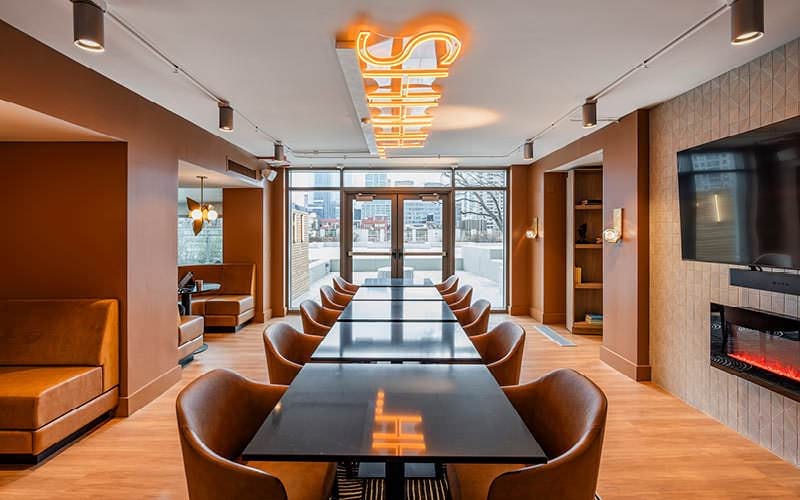 speakeasy room with tables and chairs