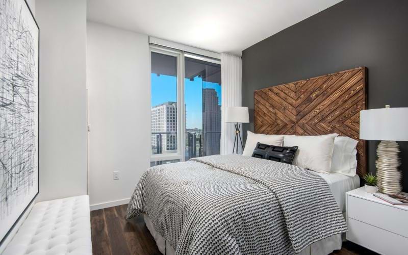 a bedroom with a large window