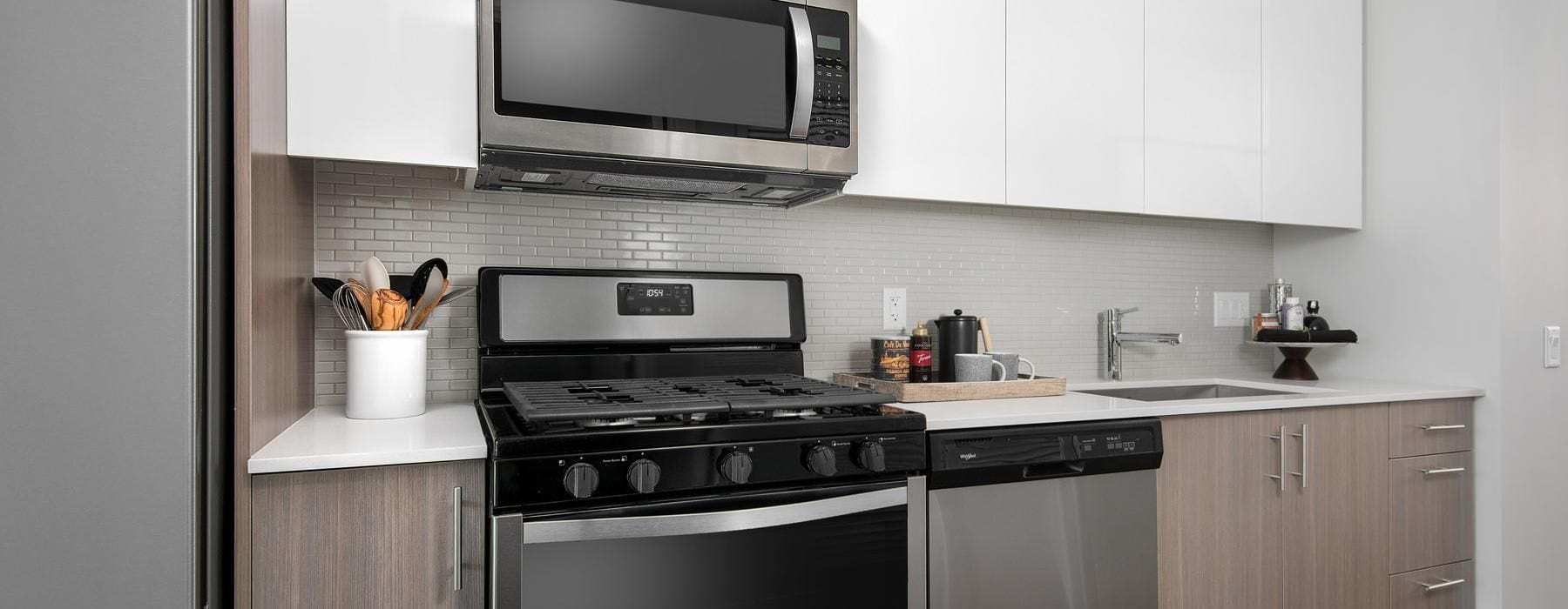 a kitchen with white cabinets
