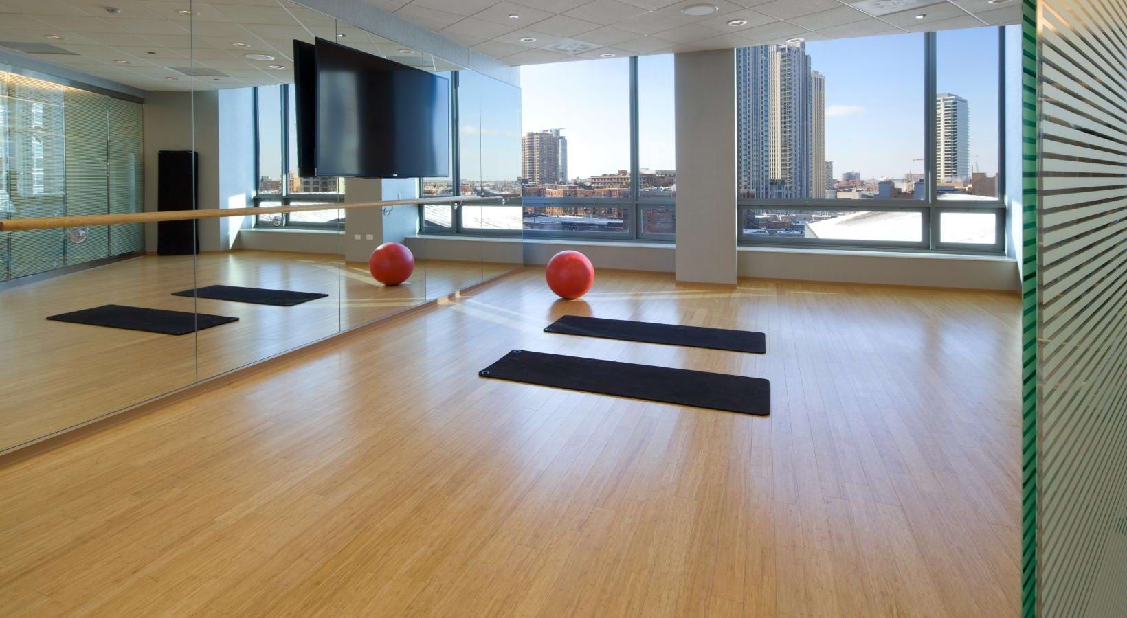 a room with medicine balls and kettle bells