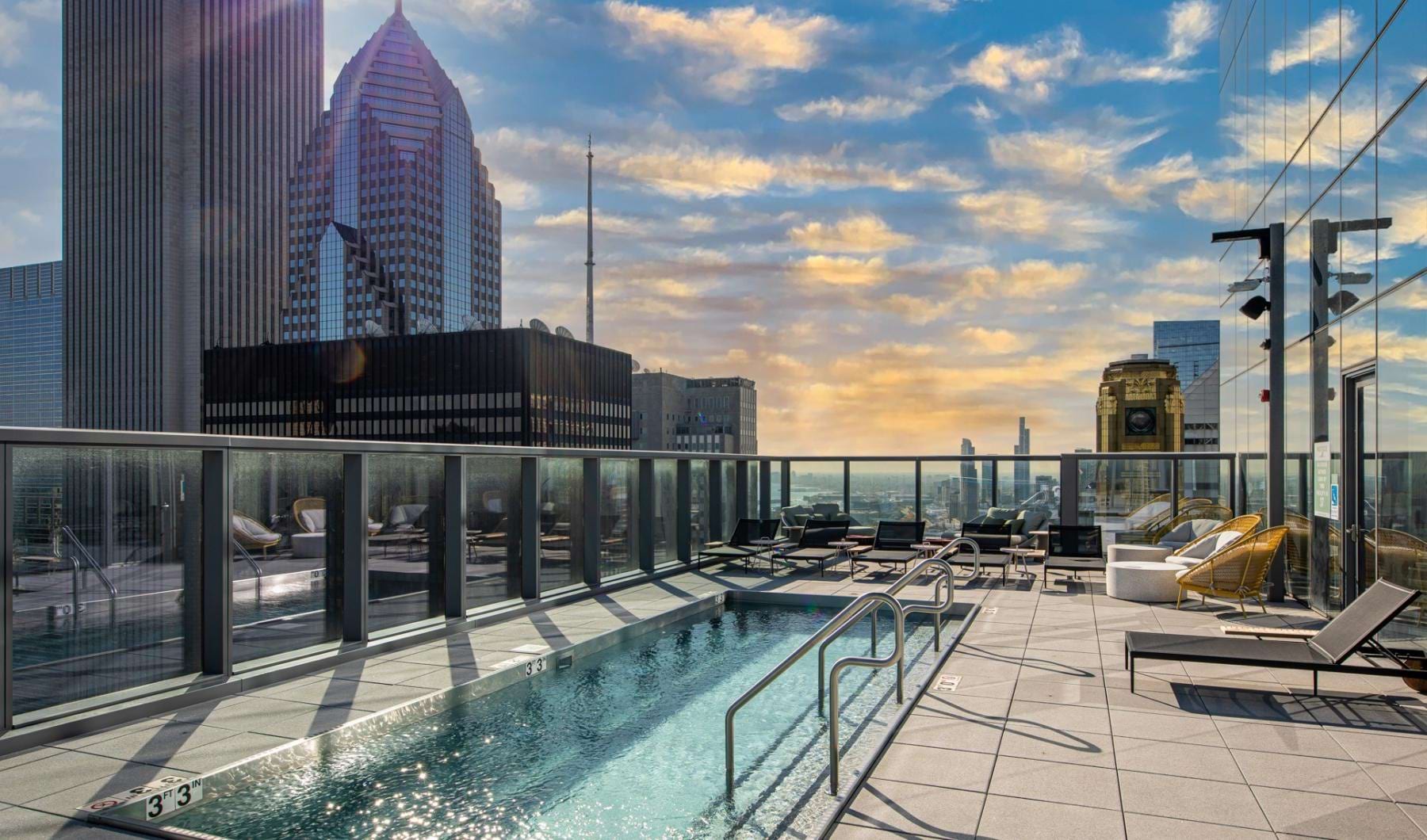 a pool with a city in the background