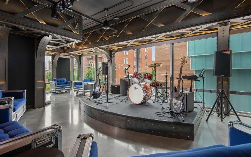a stage with a drum set and speakers