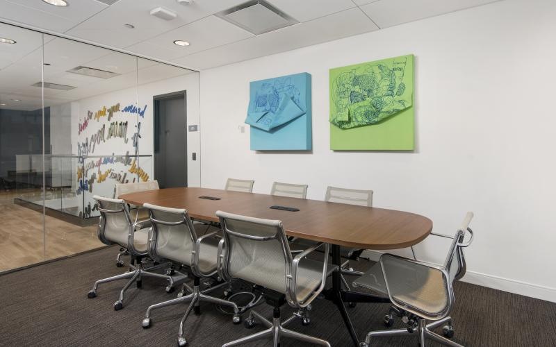 a conference room with a table and chairs
