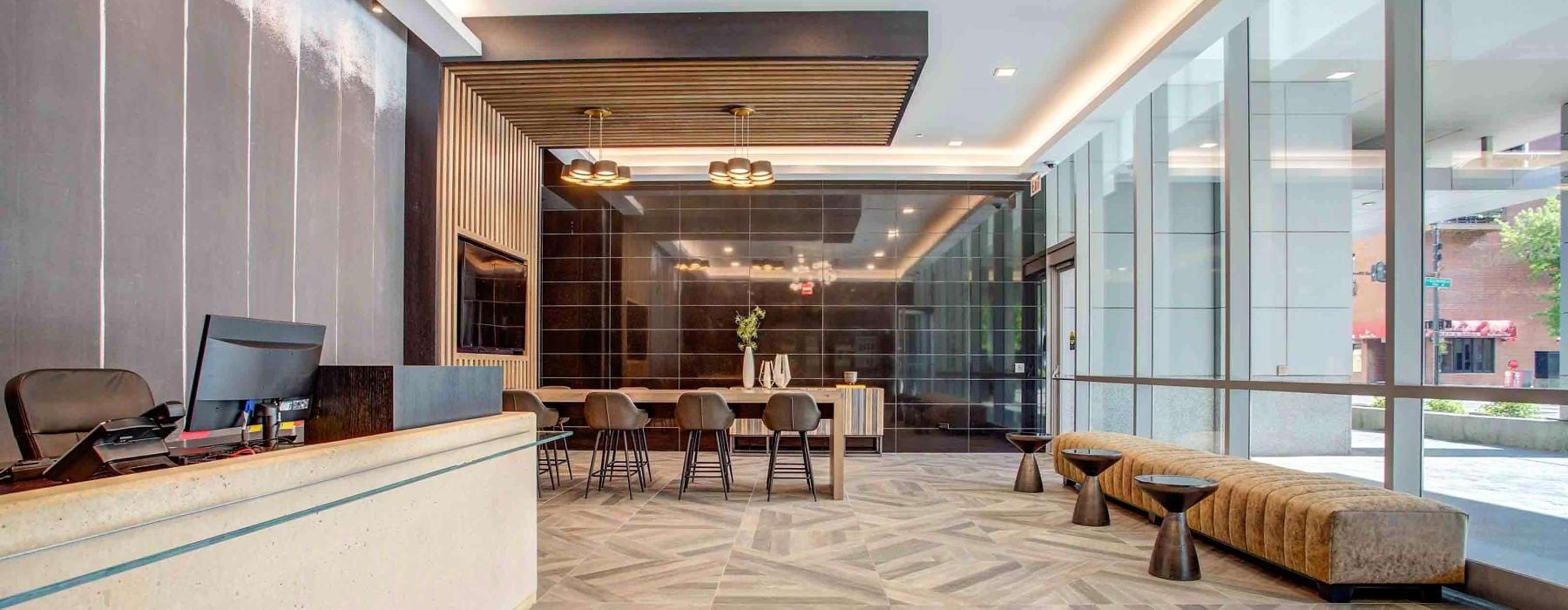 Clubhouse with a table and seating at State and Grand Apartments in Chicago.