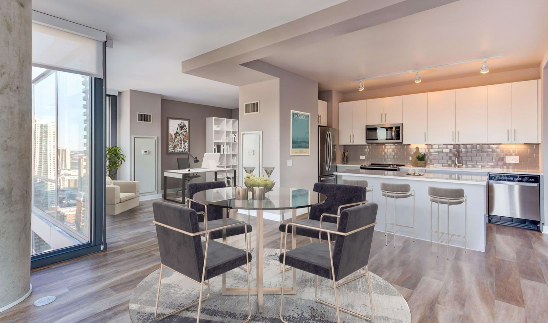 Luxury kitchen and dining area with floor to ceiling windows at State and Grand Apartments in Chicago.