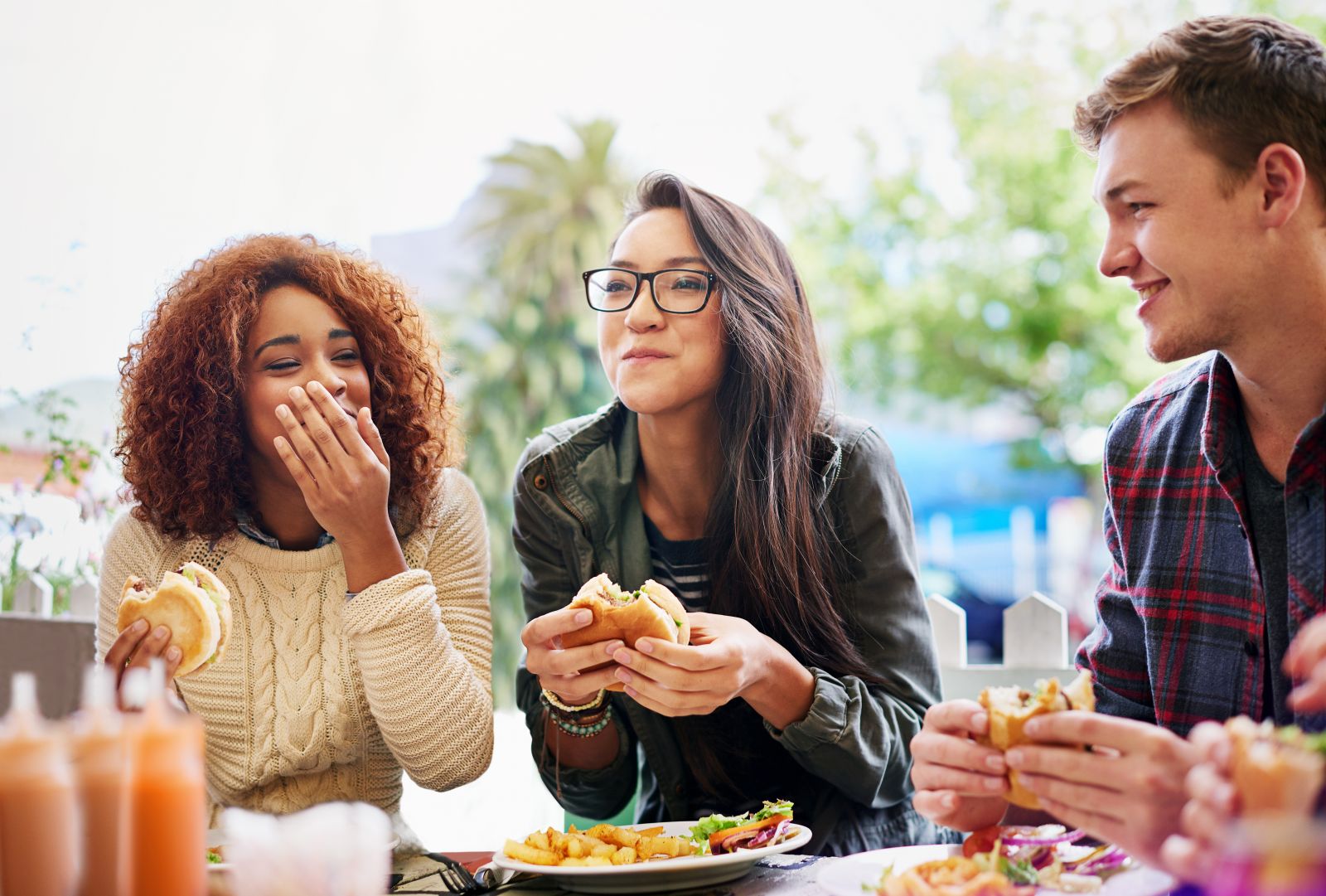 AdobeStock_487510050 People eating, laughing, and socializing