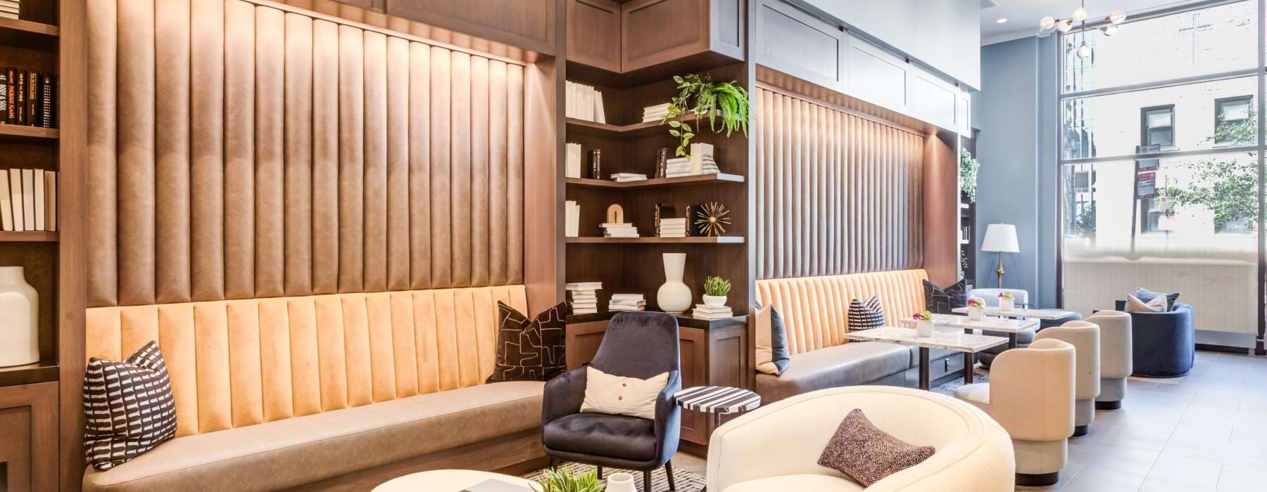 a room with a couch and chairs