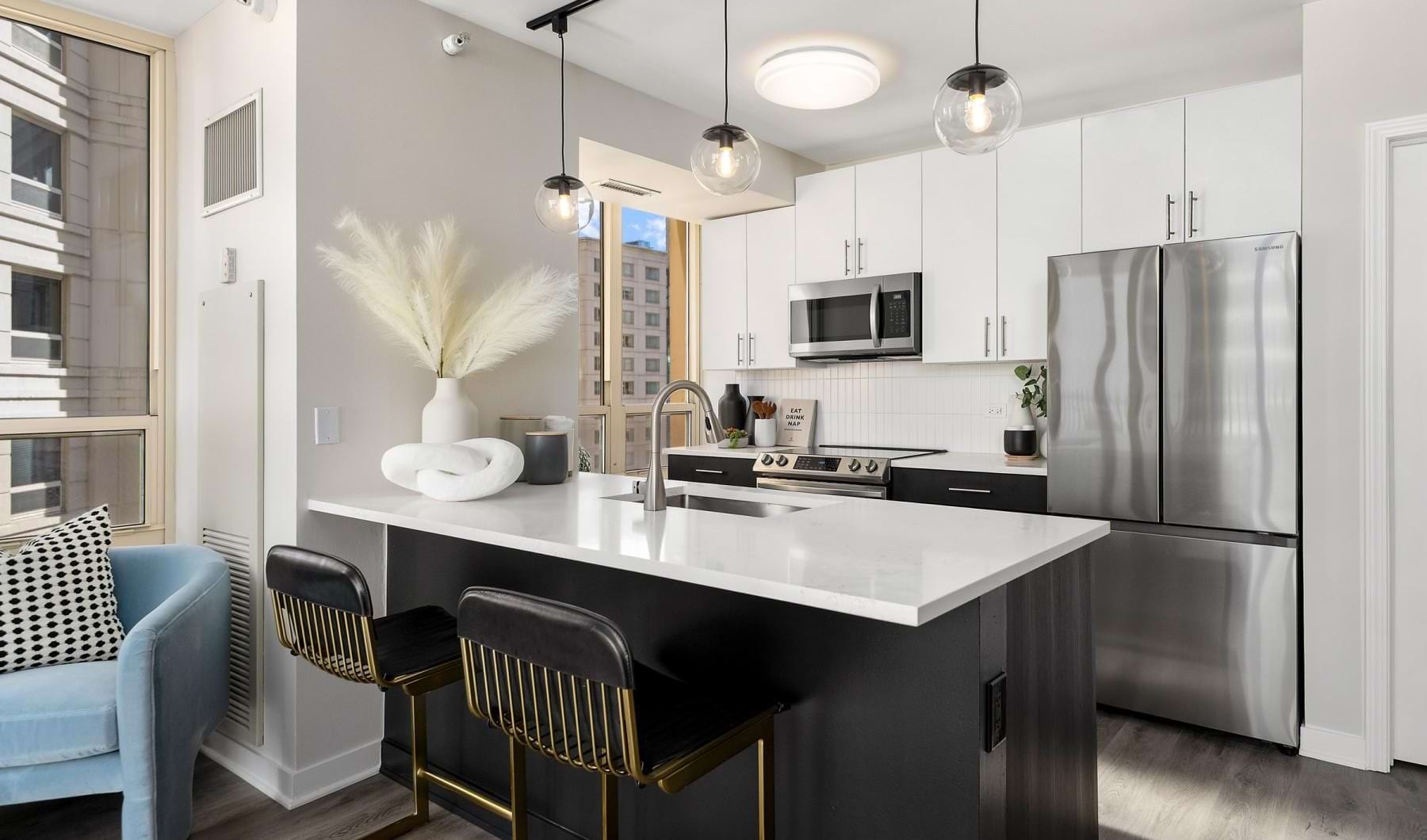 a kitchen with a black island