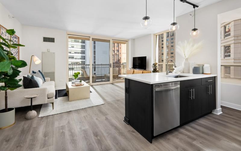 a large kitchen with a bar and a dining table