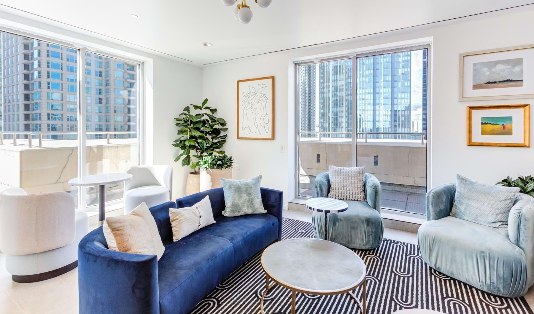 a living room with blue couches