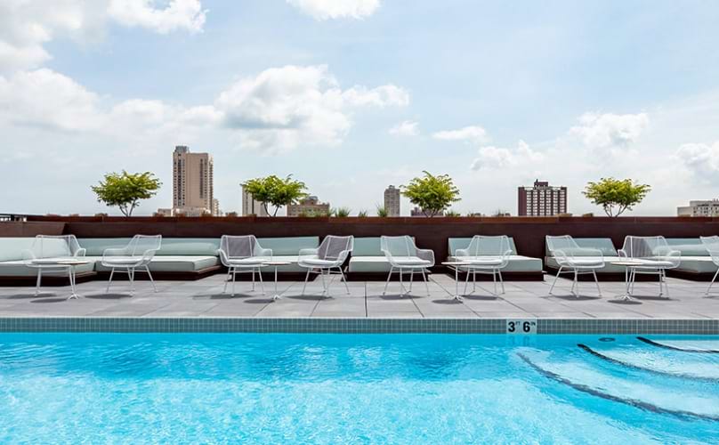 Sparkling rooftop pool with city view