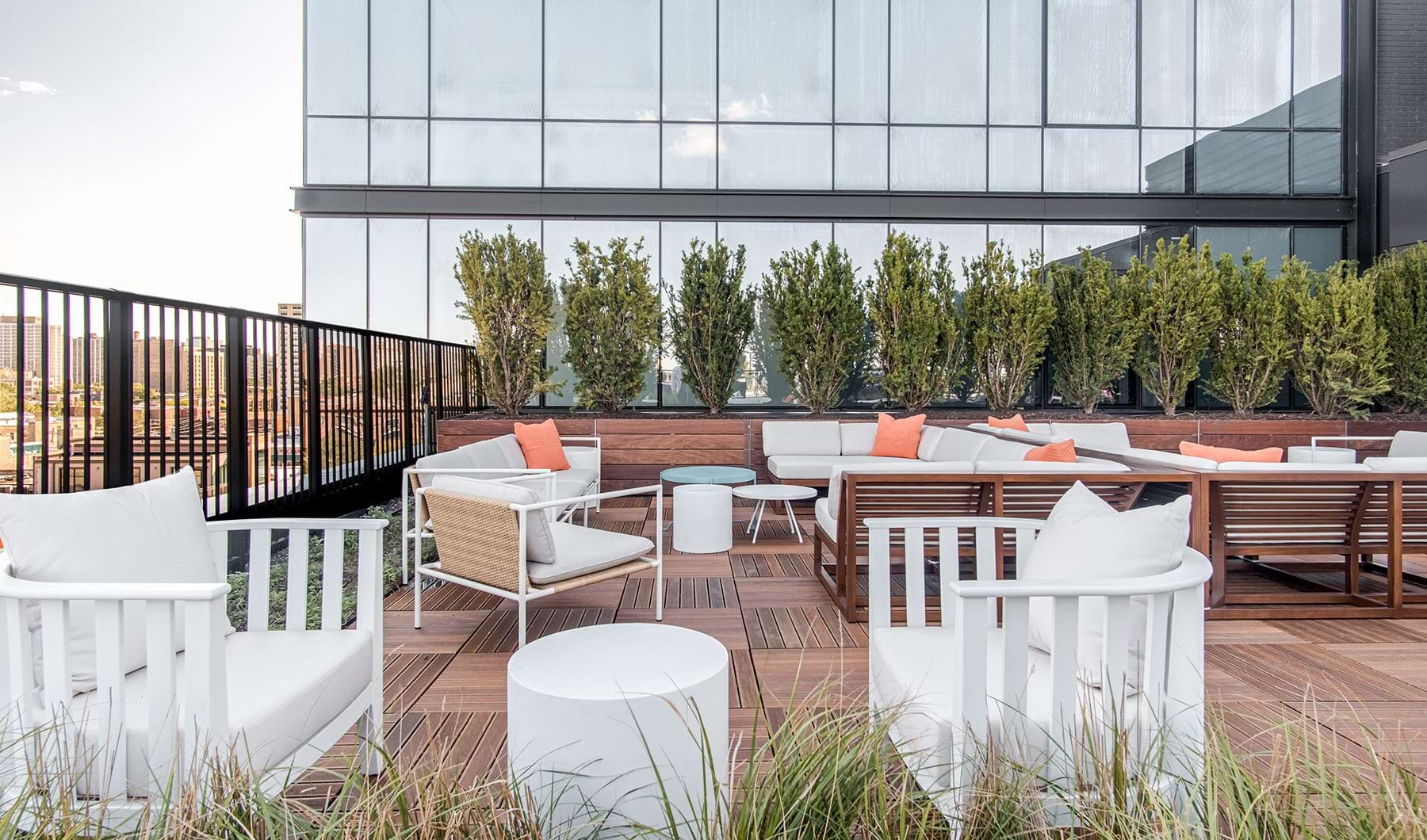Perfectly landscaped rooftop grill and seating area with pool