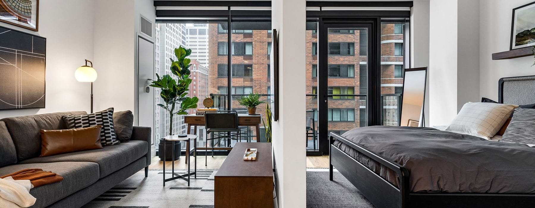living room with furniture and windows and a bed
