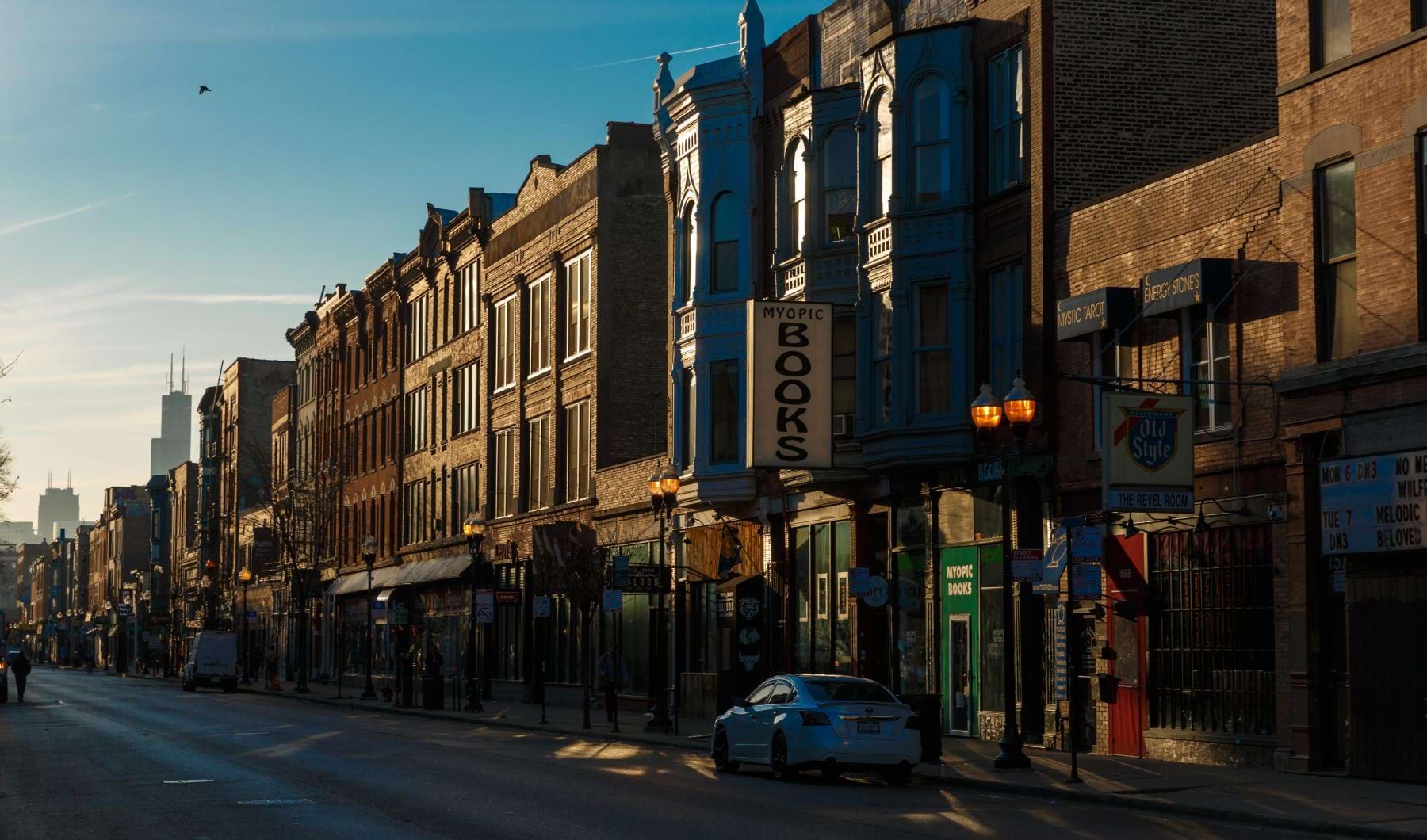 city street with apartments and shops
