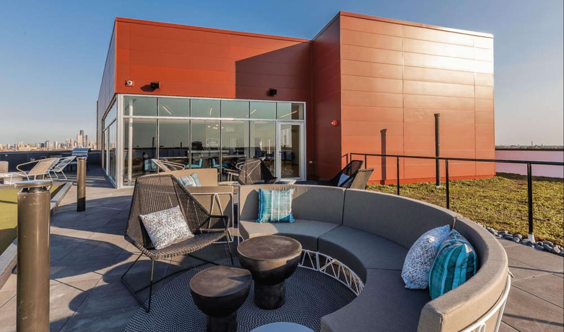 a patio with chairs and tables