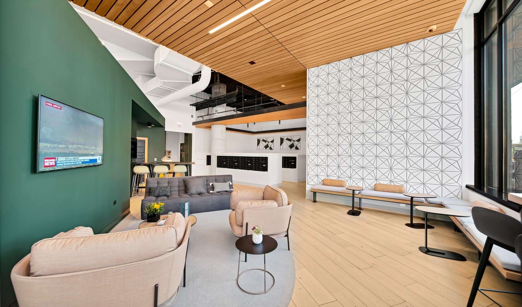 a clubhouse room with a tv and chairs