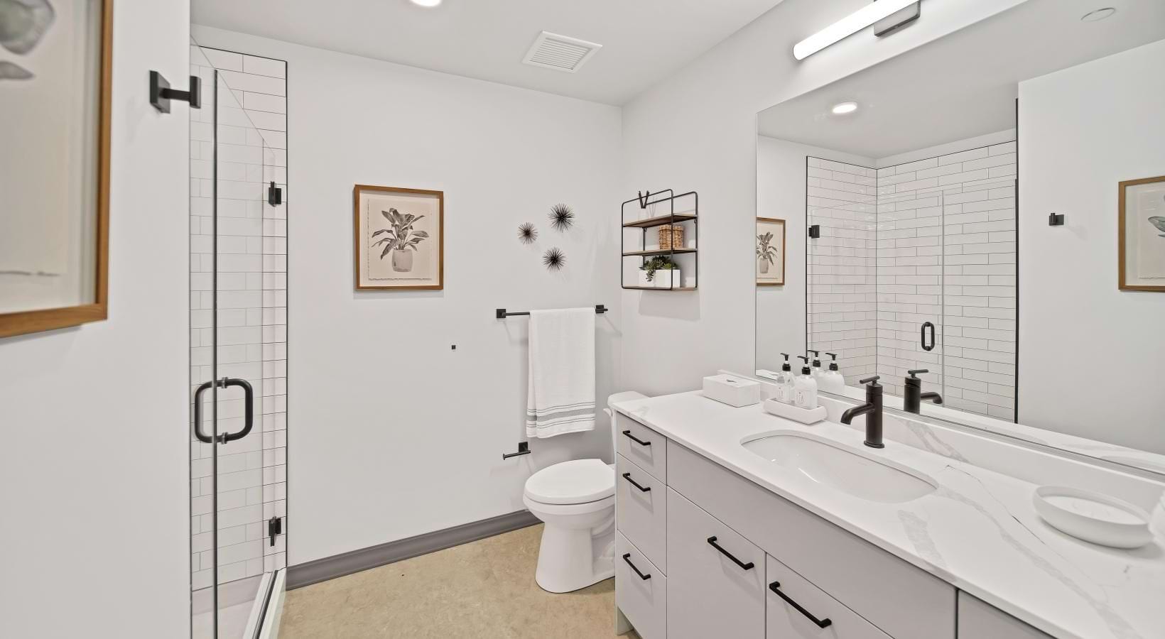 a bathroom with a sink toilet and mirror