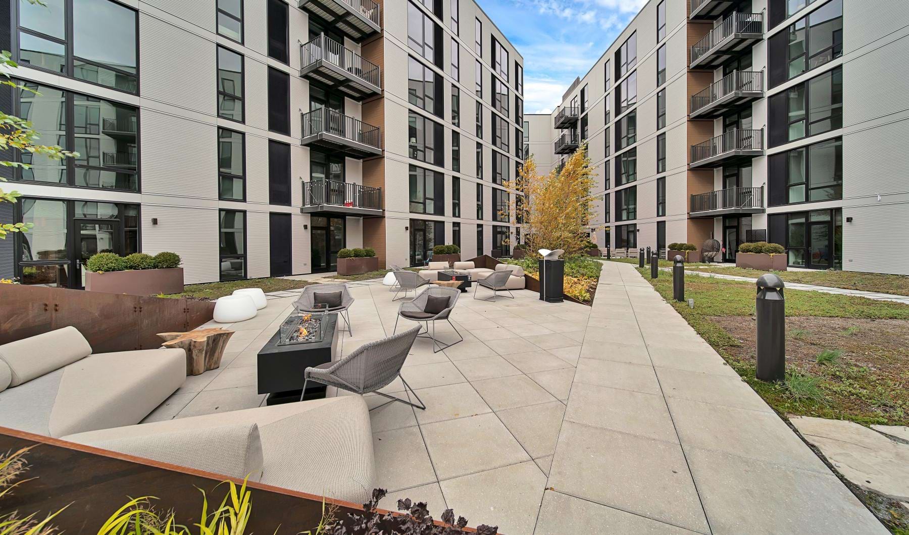 a courtyard with chairs and tables