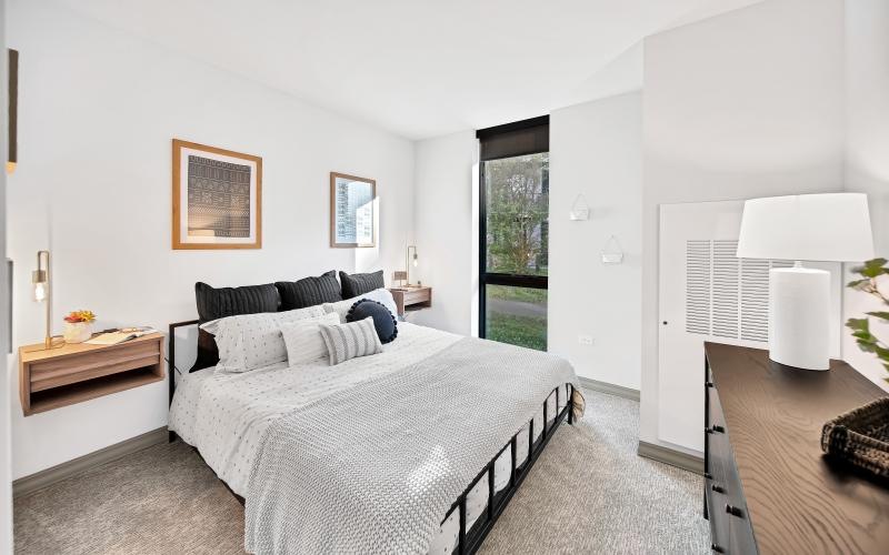 a bedroom with a bed and a desk