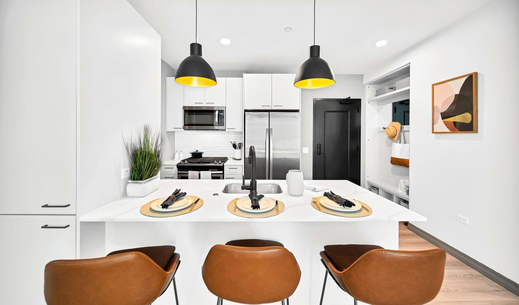 a kitchen with a table and chairs
