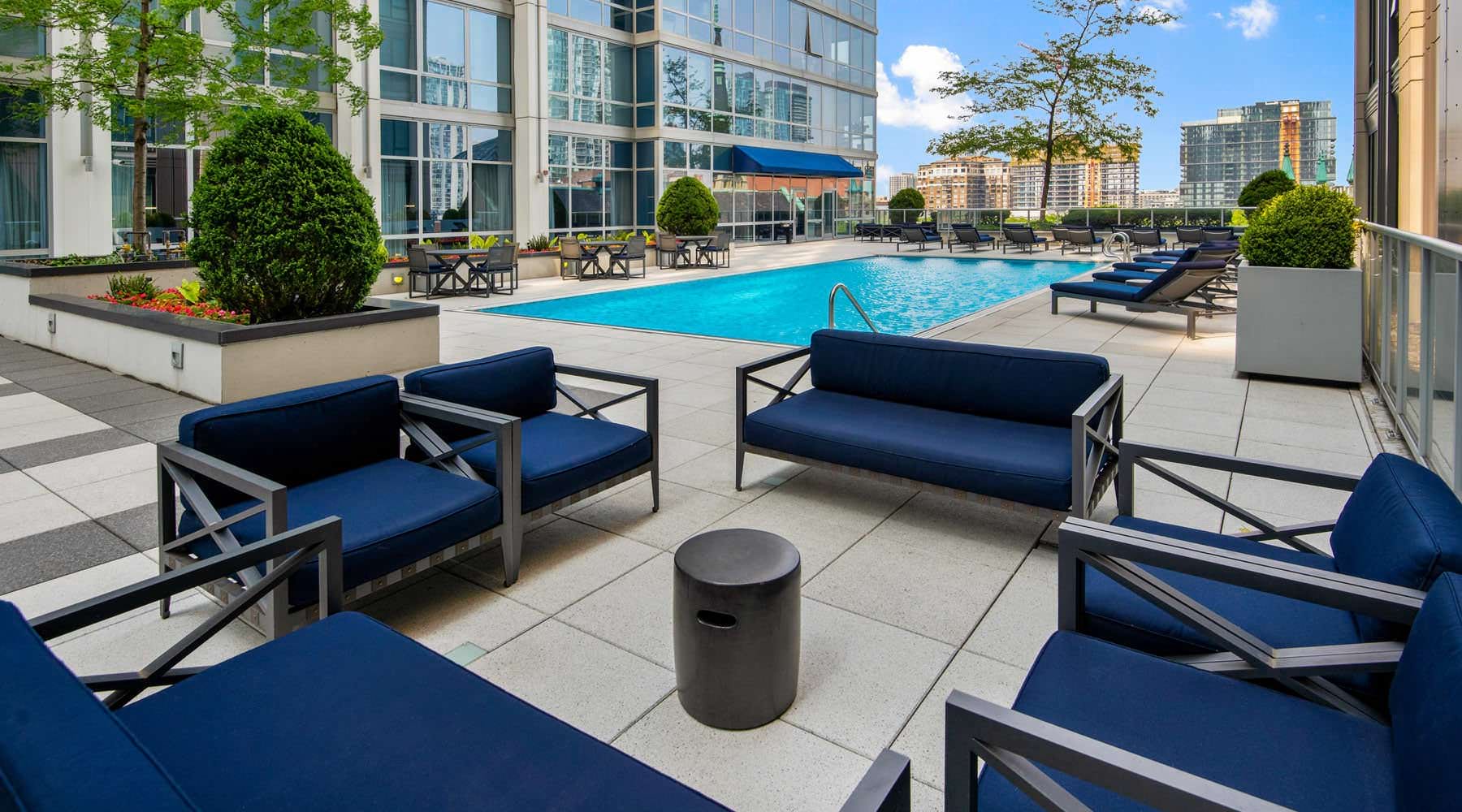 sitting area next to swimming pool